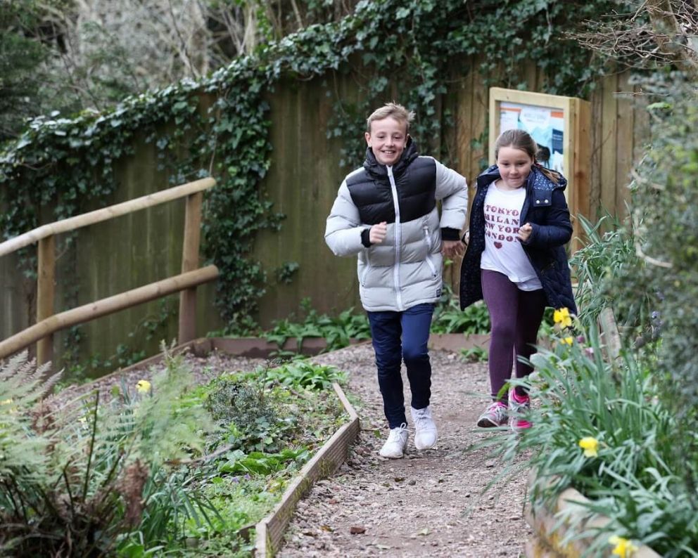 Kids running in the woods | Kents Cavern