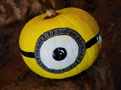 The Minions painted pumpkin in the cave at Kents Cavern, Torquay