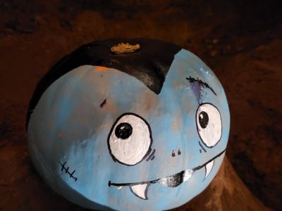 Painted pumpkin in the cave at Kents Cavern, Torquay